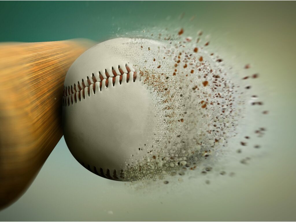 A close up picture of a bat hitting the ball scaled 1