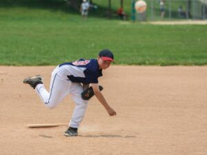 Baseball player executing a pitch scaled 1