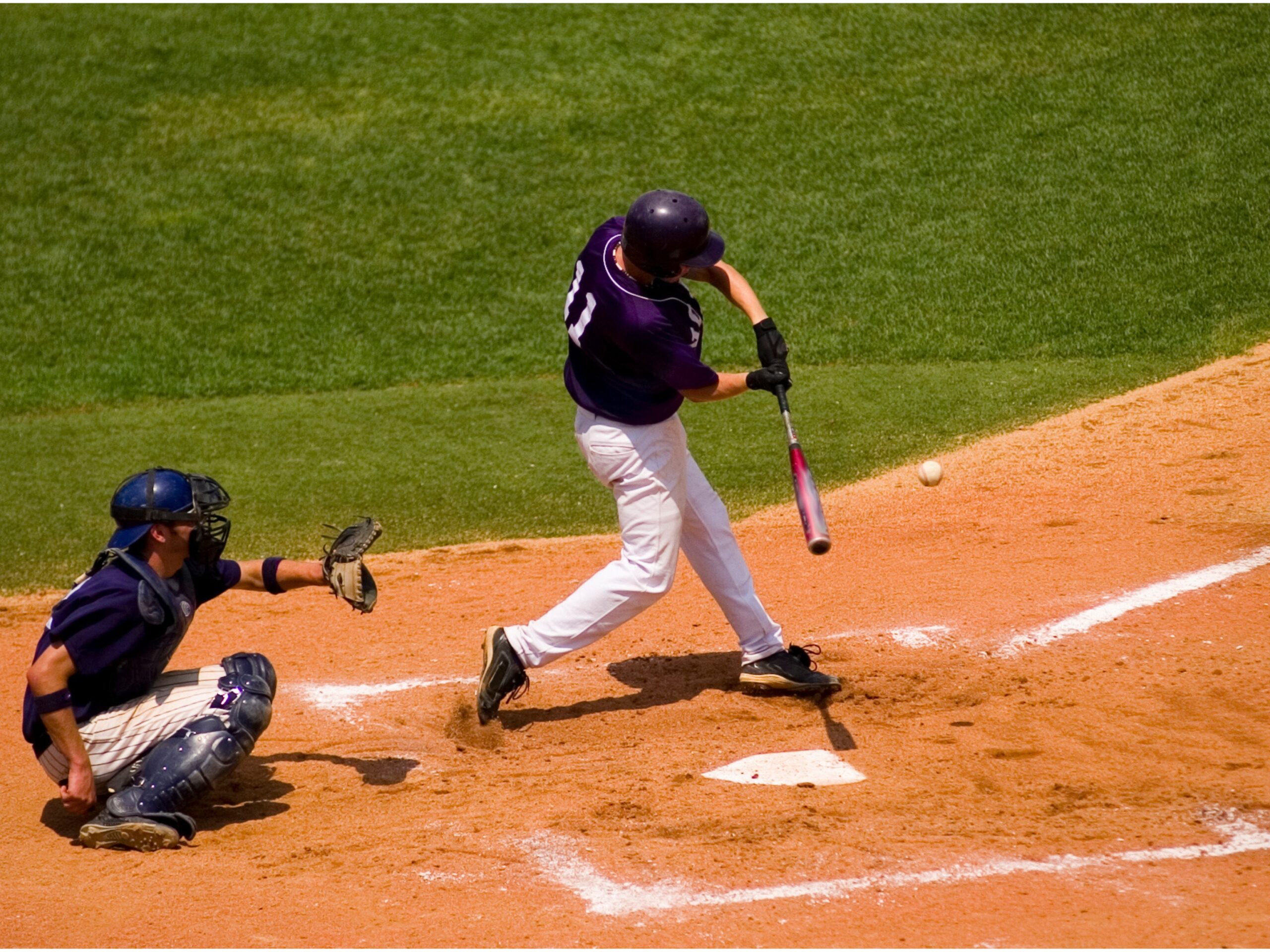 Baseball player swings the bat for a hit scaled 1