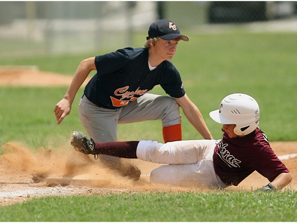 Focused baseball player sprinting towards the finish line- fueled by determination and adrenaline